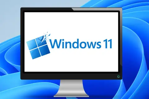Ein Monitor zeigt das Windows 11 Logo, bereit für das Einrichten des neuen PCs.