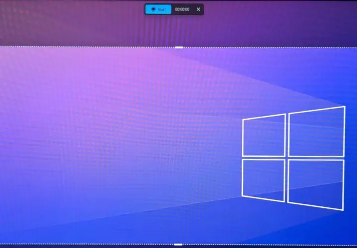 Bildschirmaufnahme von Windows 11 mit dem Start-Button und Timer. Das Fenster ist mit gestrichelten Linien markiert.