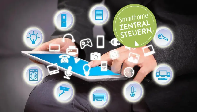 Person steuert per Tablet das Smarthome. Icons für Licht, Kühlschrank, Waschmaschine, Kamera, Heizung, Musik, Spiele, Schlüssel, Fenster, Drucker, Handy, Chip, Computer, Garage, Telefon, Mikrofon, Fernseher. Was ist Matter?